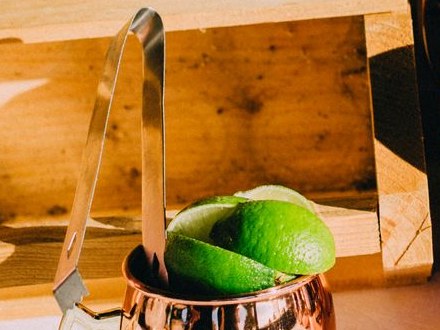 Fresh lime wedges in a copper mule mug